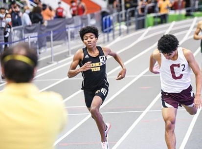 Boys track runner racing