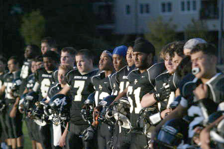 Football players on sideline
